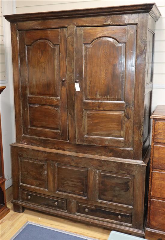 A mid 18th century walnut press cupboard, with two panelled doors and two base drawers, on stile feet W.135cm